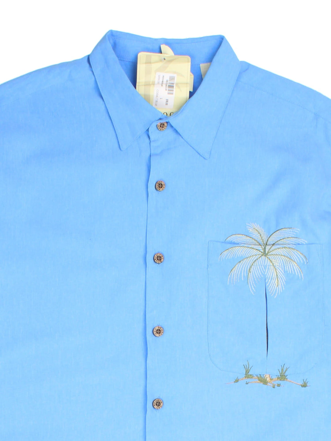 Vintage Hawaiian Shirt in a blue colourway, palm tree embroidery detail and front pocket.