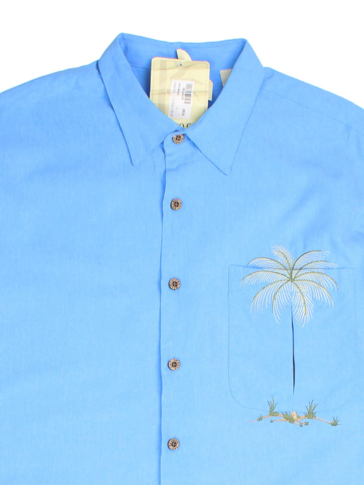 Vintage Hawaiian Shirt in a blue colourway, palm tree embroidery detail and front pocket.