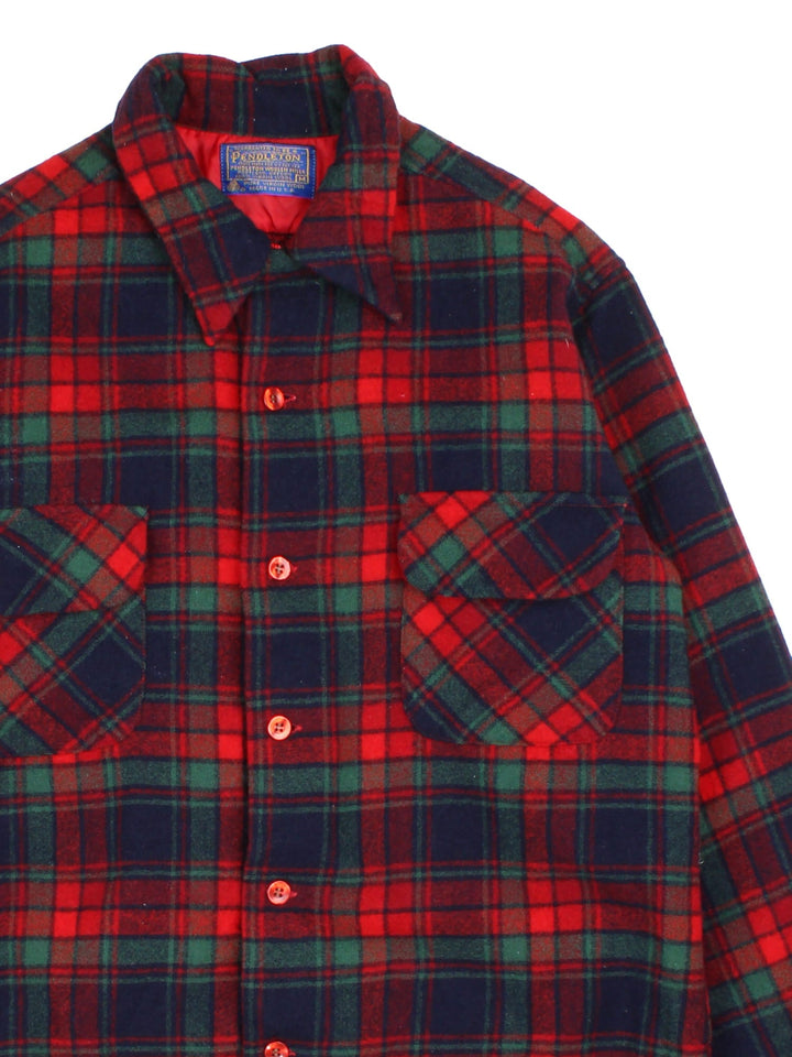 Pendleton Shirt in a red colourway, with green and blue checks. Button up with front patch pockets.