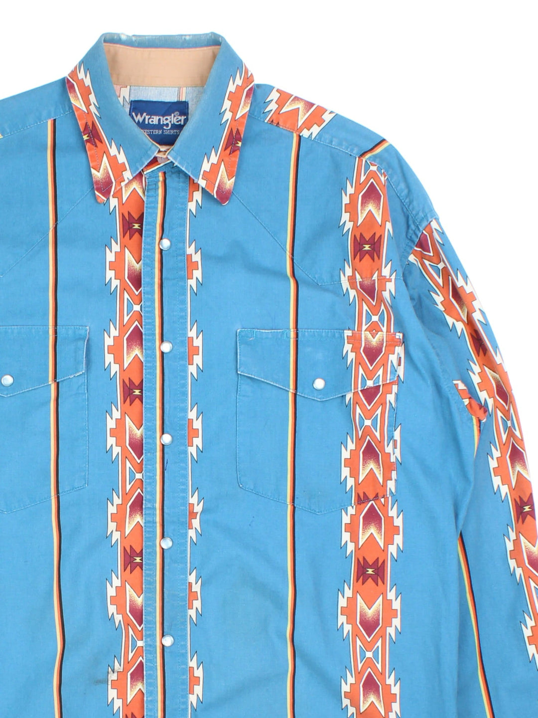 Wrangler Western Shirt in a blue colourway with aztec pattern. Button up with two pockets on the front.