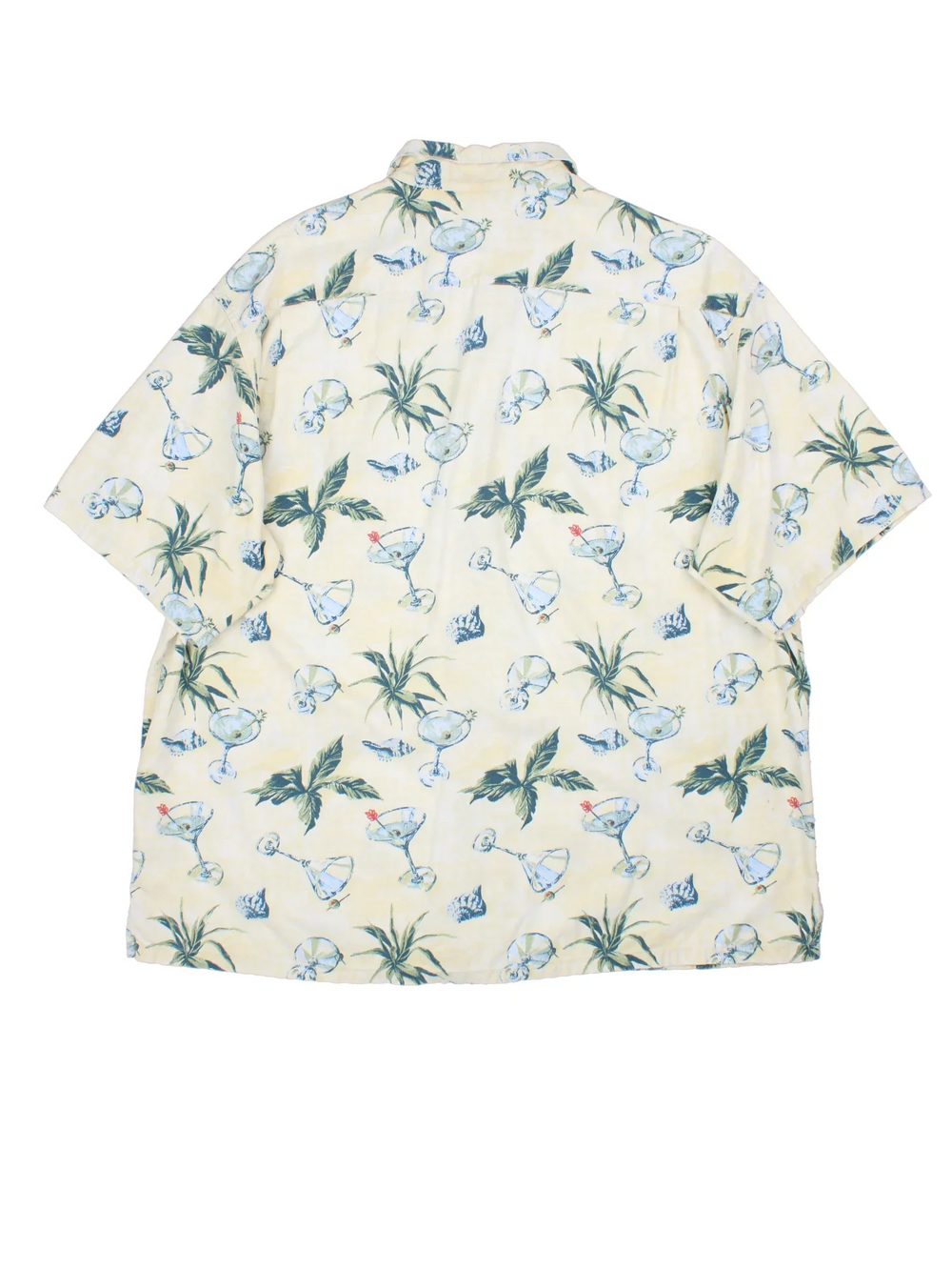 Columbia Hawaiian Shirt in a tan colourway with floral and cocktail all over print, button up and has a chest pocket with the logo embroidered on.