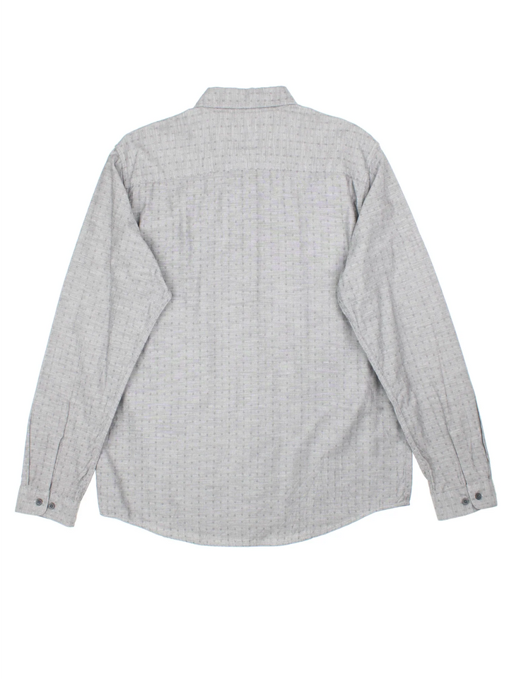 Patagonia Shirt in a grey colourway, button up and has a chest pocket, and the logo tab embroidered on the side.