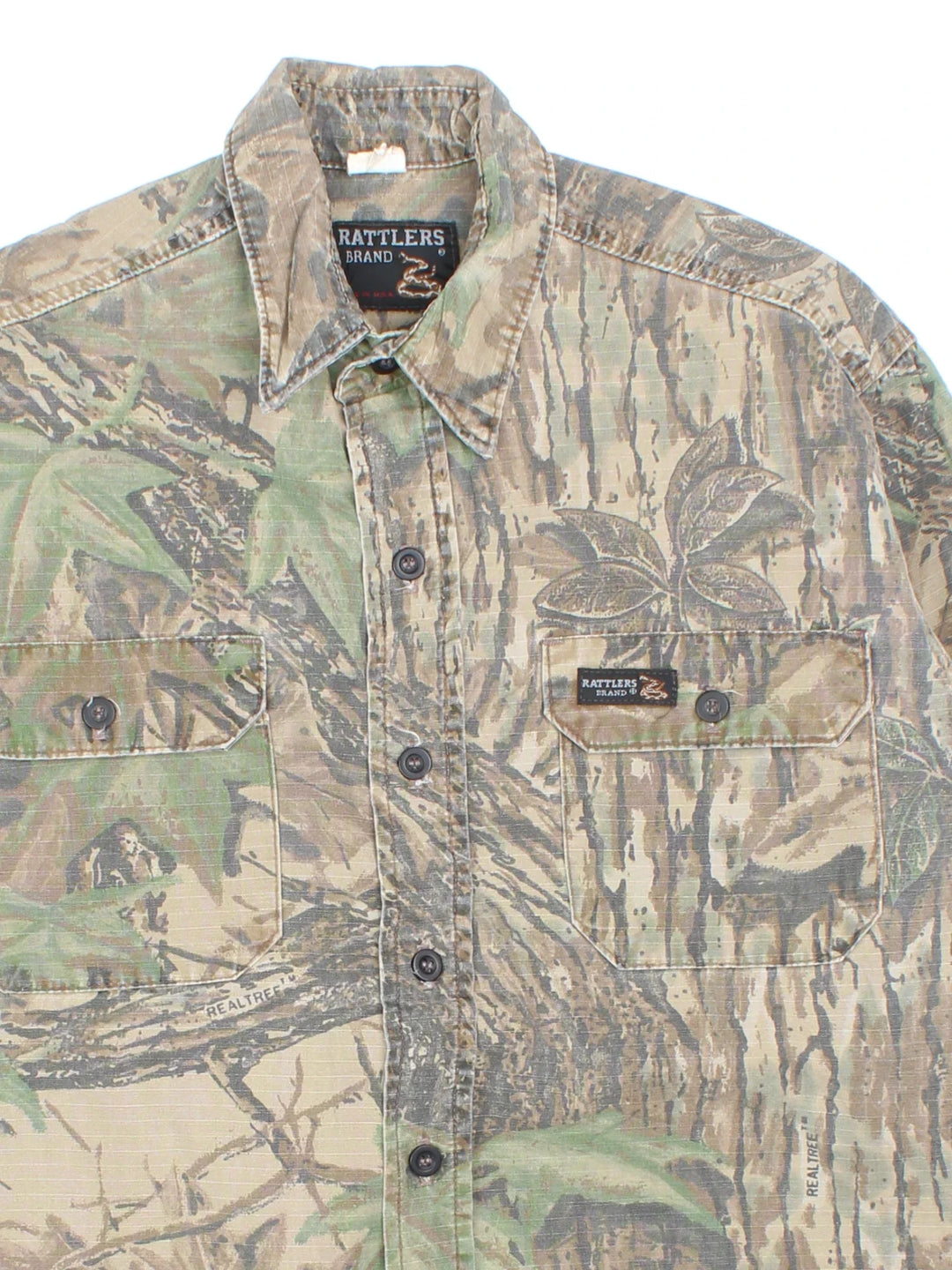 Vintage Rattlers Real Tree Camo Shirt in a green and brown colourway, button up and has double chest pockets with the logo embroidered on the front.