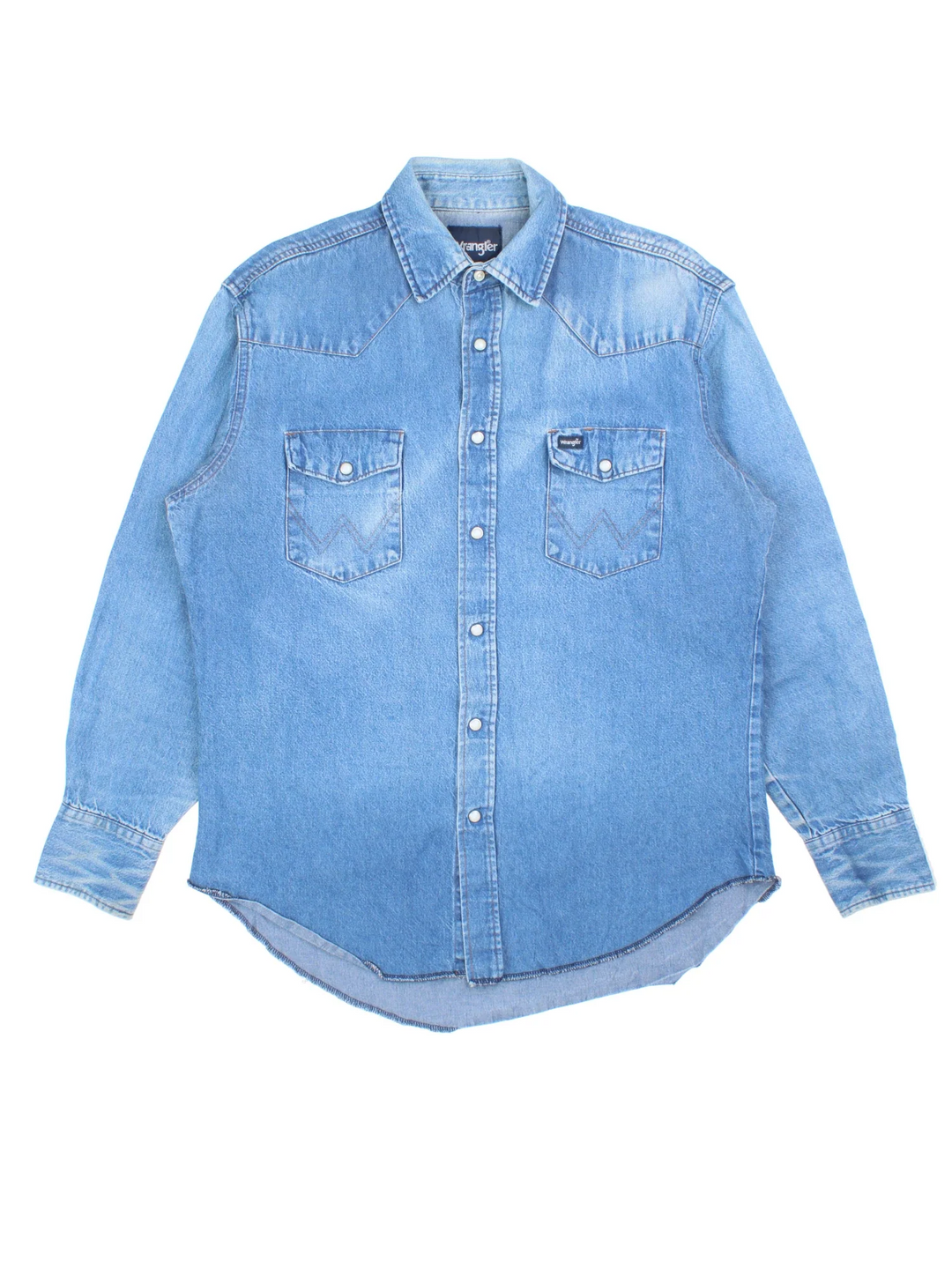 Wrangler Denim Western Shirt in a blue colourway, button up and has double chest pockets with the logo tab embroidered on the front.
