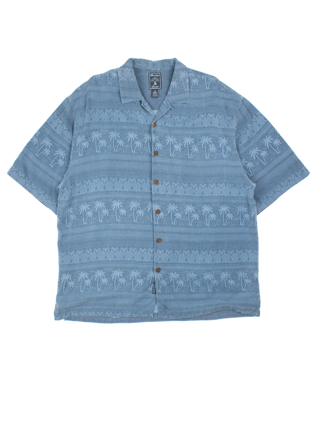 Vintage Hawaiian Shirt in a blue colourway with palm tree pattern all over, button up and has a chest pocket.