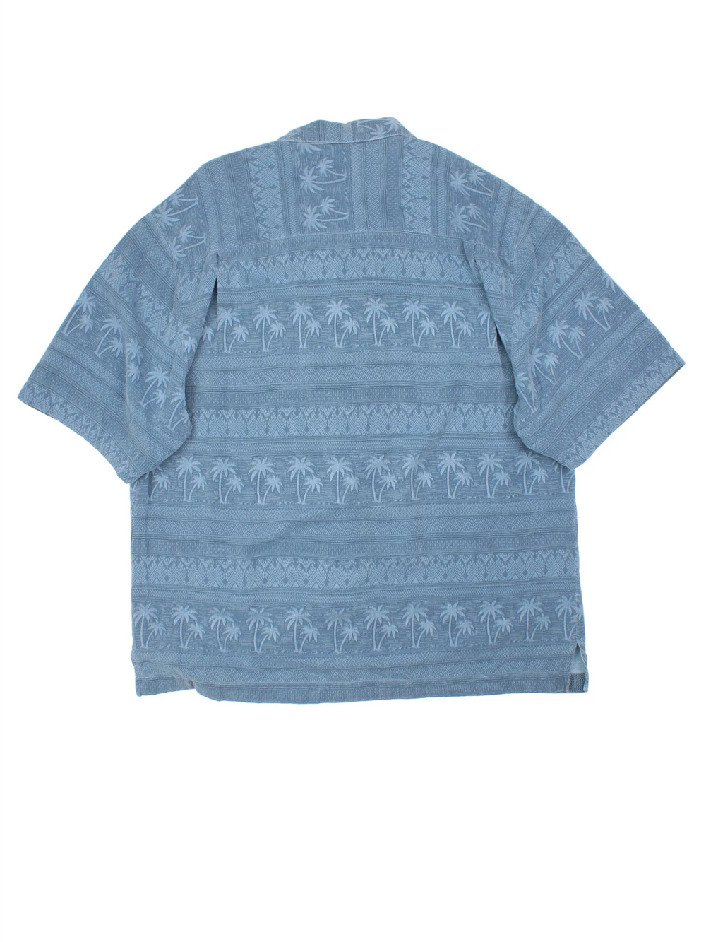 Vintage Hawaiian Shirt in a blue colourway with palm tree pattern all over, button up and has a chest pocket.