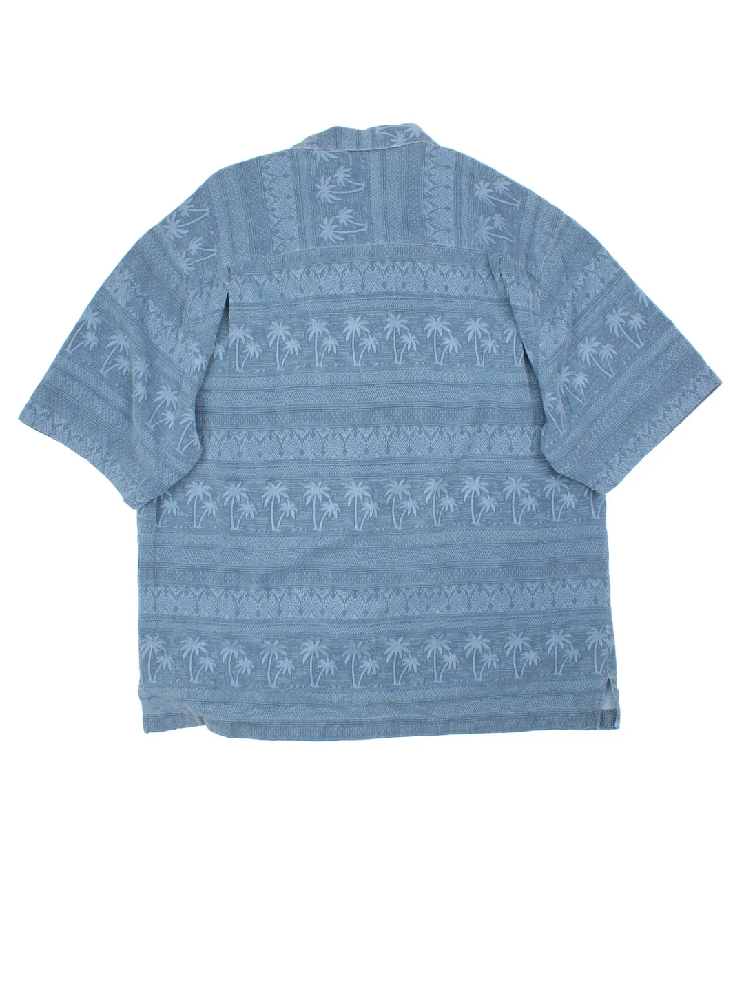Vintage Hawaiian Shirt in a blue colourway with palm tree pattern all over, button up and has a chest pocket.