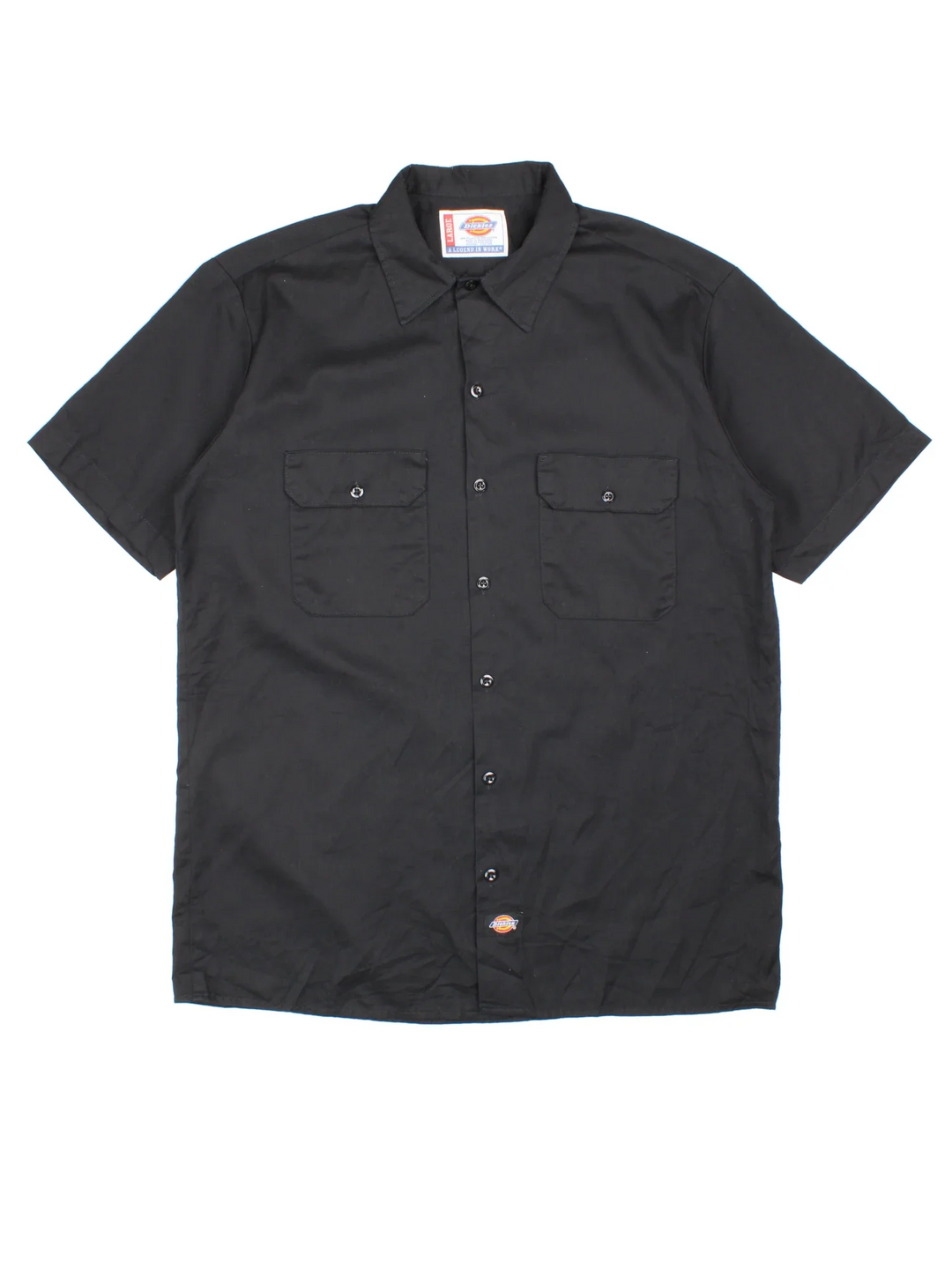 Dickies Work Shirt in a black colourway, button up with double chest pockets and the logo embroidered by the hem.