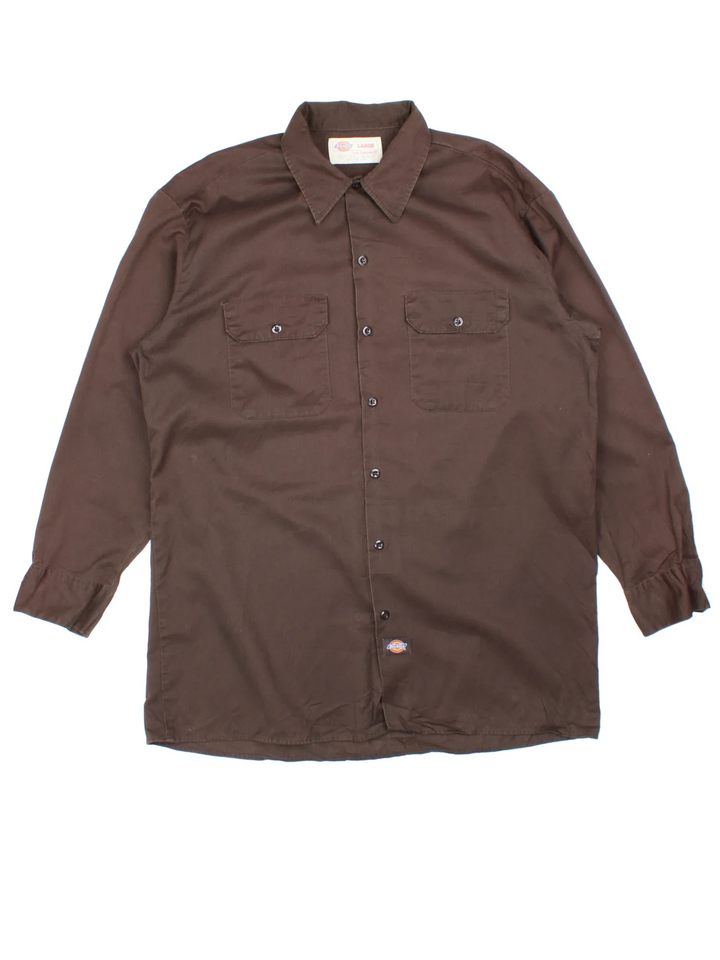 Dickies Work Shirt in a brown colourway, button up with double chest pockets and the logo embroidered by the hem.