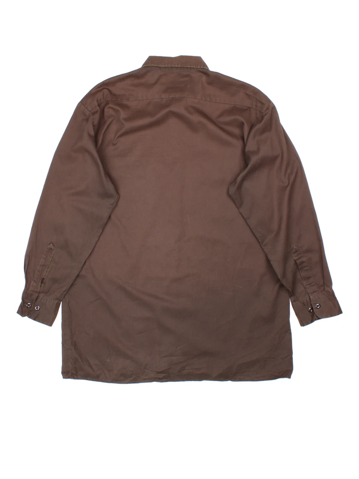 Dickies Work Shirt in a brown colourway, button up with double chest pockets and the logo embroidered by the hem.