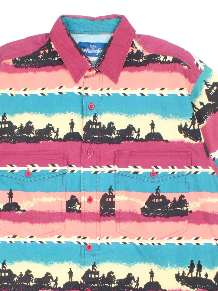 Wrangler Shirt in a pink/blue colourway. All over print, button up with 2 pockets on the front.