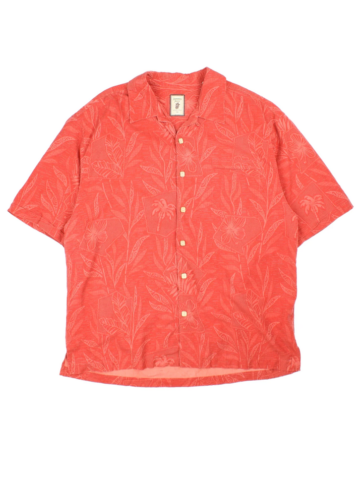Vintage Hawaiian Shirt in a orange colourway with all over floral leaf print. Button up and has a front chest pocket.