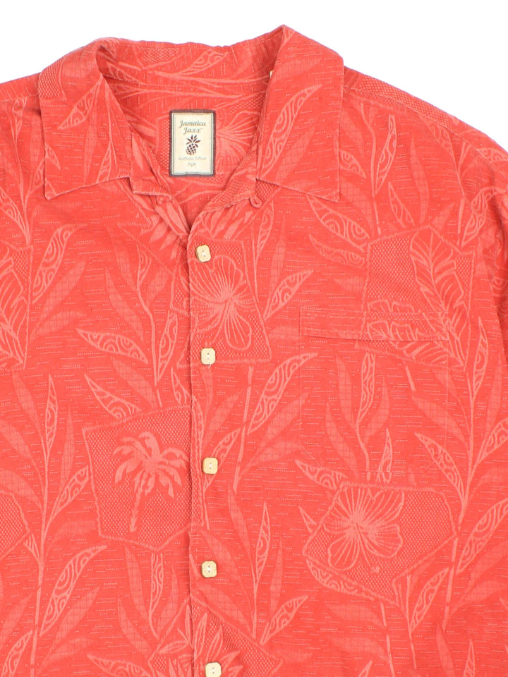 Vintage Hawaiian Shirt in a orange colourway with all over floral leaf print. Button up and has a front chest pocket.