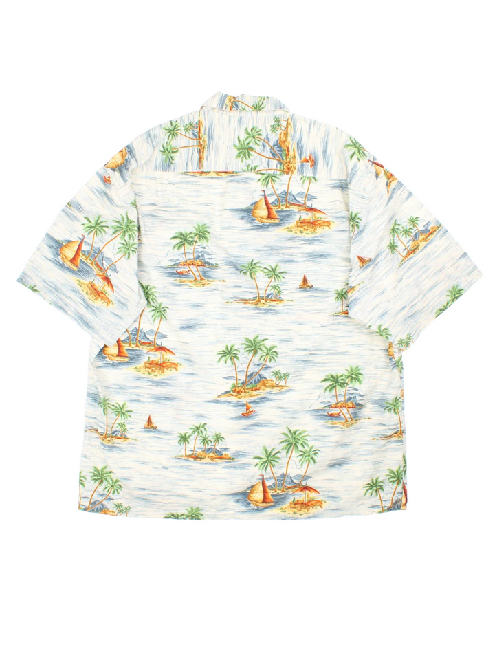 Vintage Pierre Cardin Shirt in a white/blue colourway with all over Hawaiian print. Button up and front chest pocket.