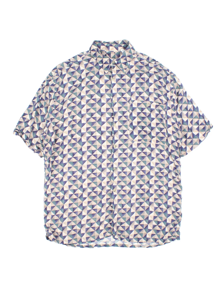 Vintage Pierre Cardin Shirt in a blue colourway with abstract pattern print all over. Button up with front pocket detail.