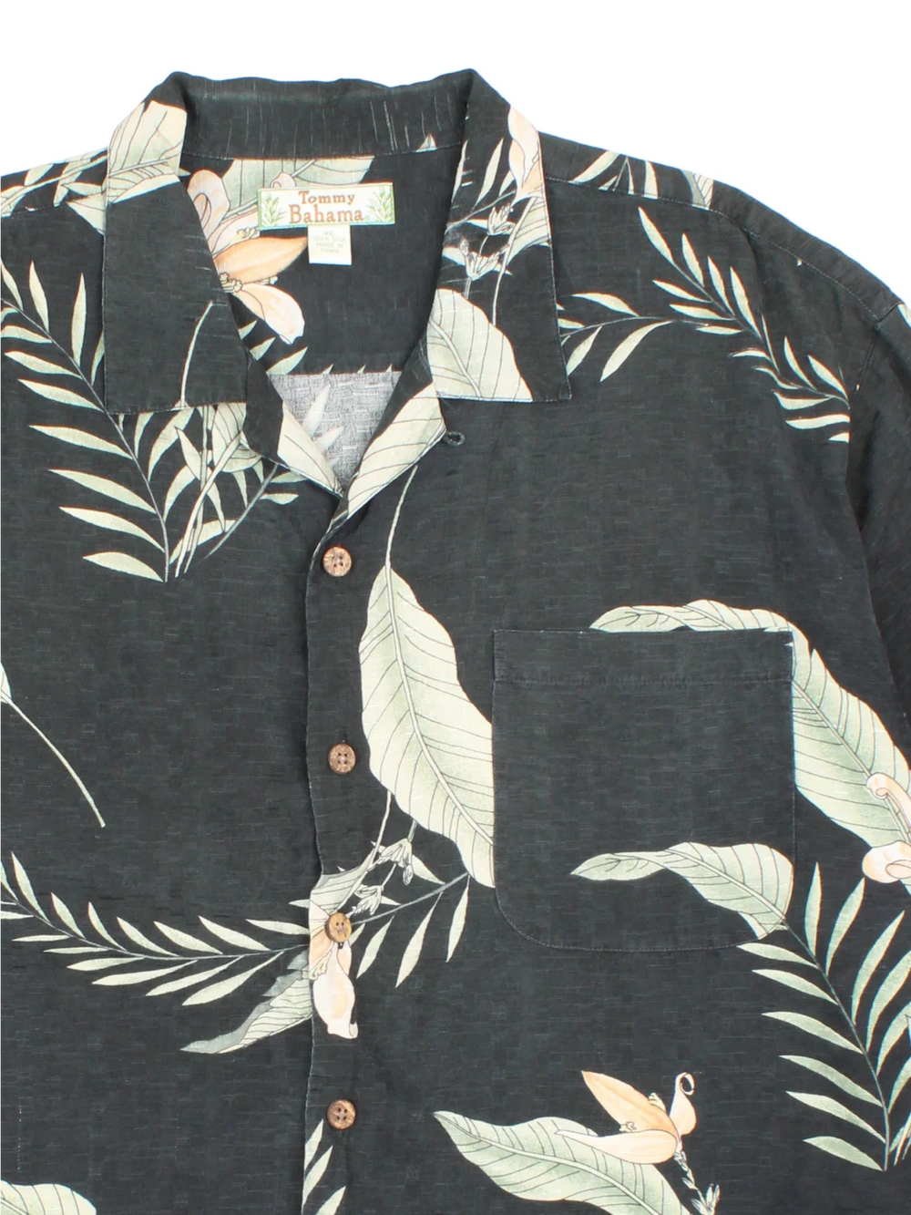 Tommy Bahama Hawaiian Shirt in a black colourway with all over leaf print. Button up with front chest pocket.
