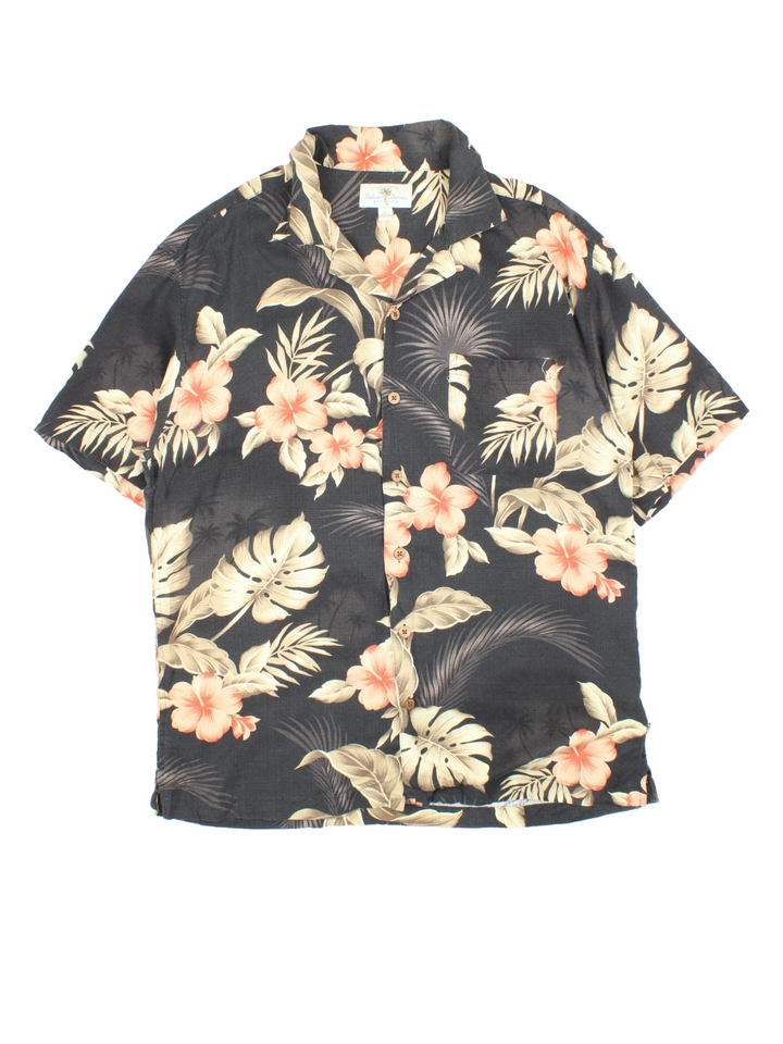 Vintage Hawaiian Shirt in a black colourway with all over leaf print. Button up with front chest pocket.