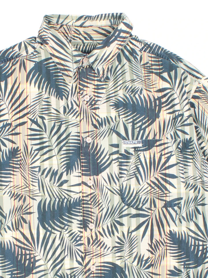 Chaps Ralph Lauren Hawaiian Shirt in a green colourway with all over leaf print. Button up with branded front chest pocket.