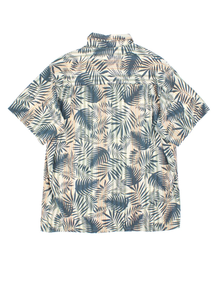 Chaps Ralph Lauren Hawaiian Shirt in a green colourway with all over leaf print. Button up with branded front chest pocket.