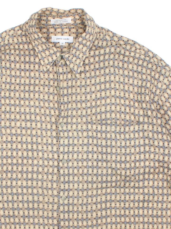 Vintage Pierre Cardin Shirt in a tan colourway with all over print. Button up with front pocket detail.
