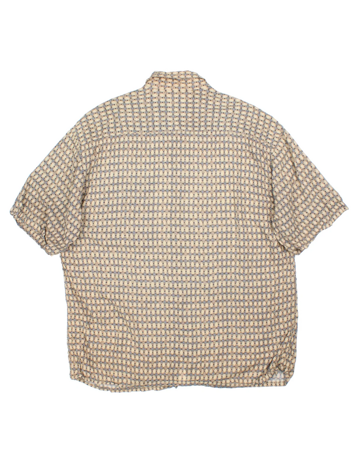 Vintage Pierre Cardin Shirt in a tan colourway with all over print. Button up with front pocket detail.