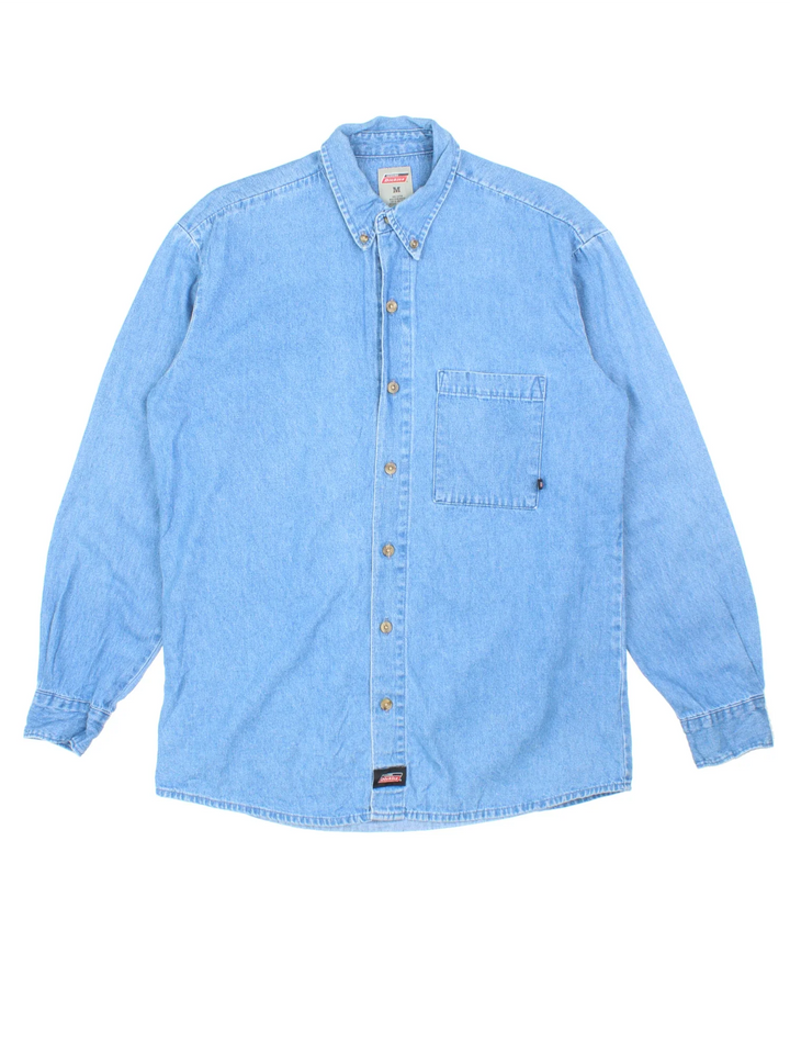 Dickies Denim Shirt in a blue colourway, button up and has a chest pocket with the logo embroidered on the front.