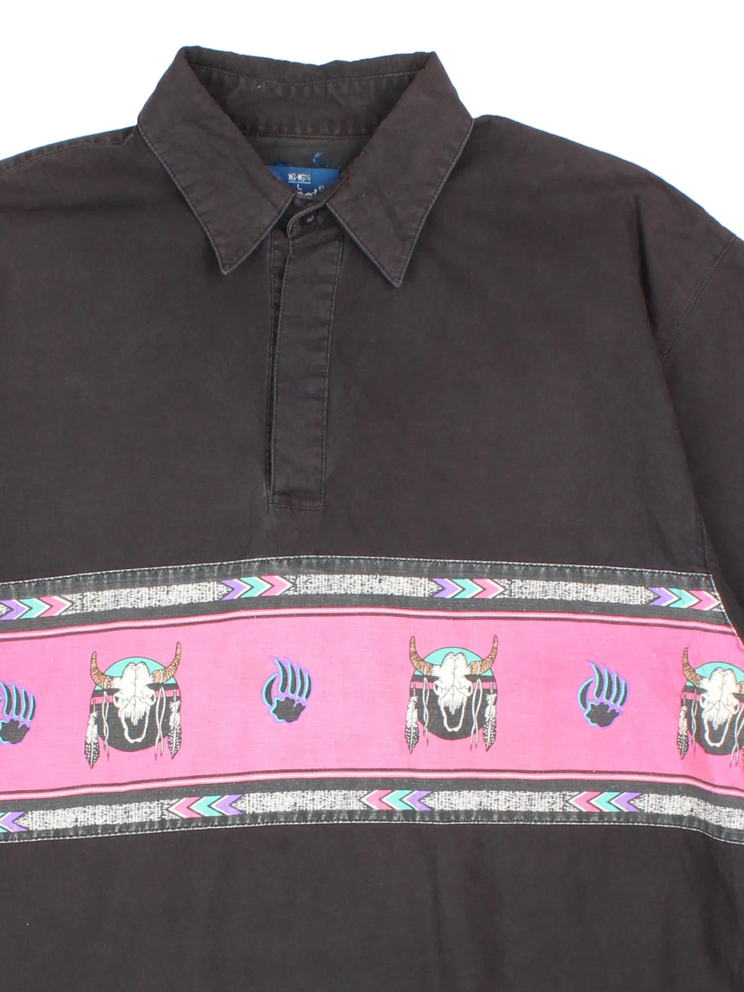 Vintage Wrangler Western Shirt in a black colourway, pullover with a button up collar and has western skull pattern stripe across the front.