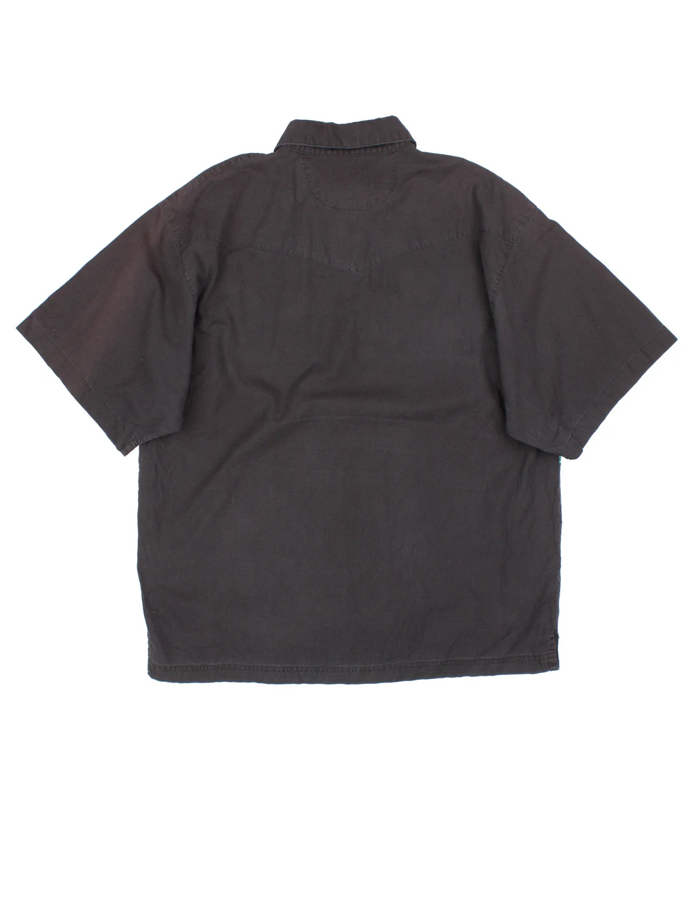 Vintage Wrangler Western Shirt in a black colourway, pullover with a button up collar and has western skull pattern stripe across the front.