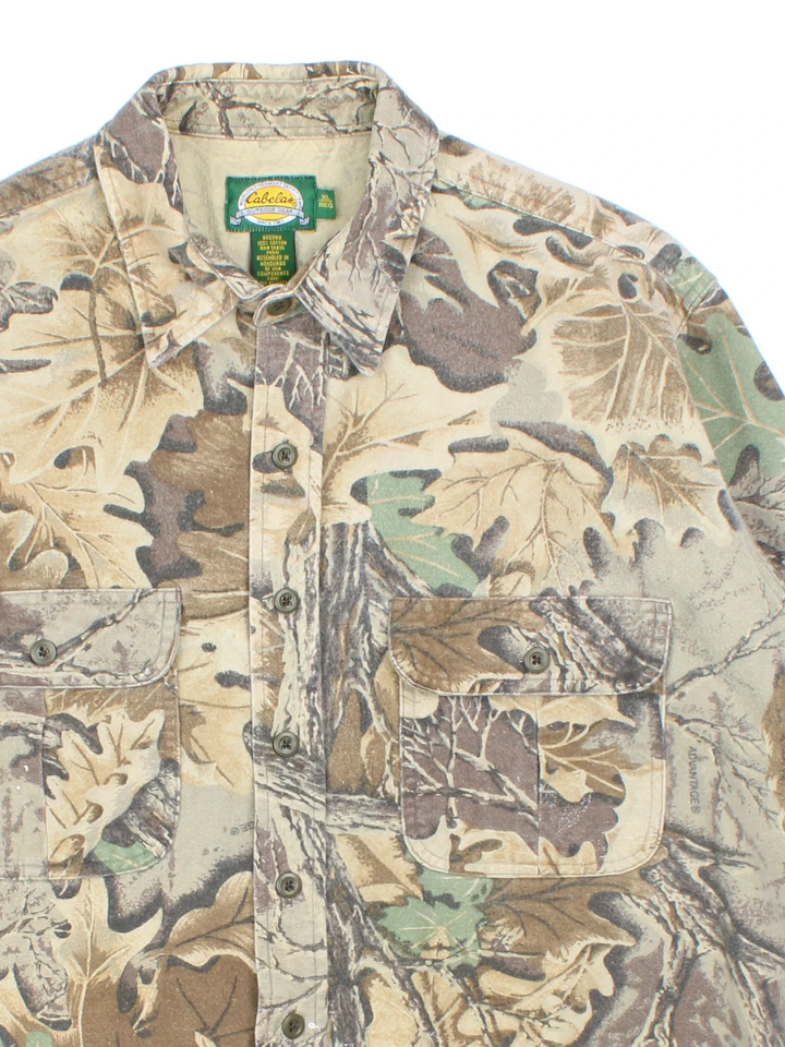 Cabela's Real Tree Camo Shirt in a green and brown colourway, button up and has double chest pockets.