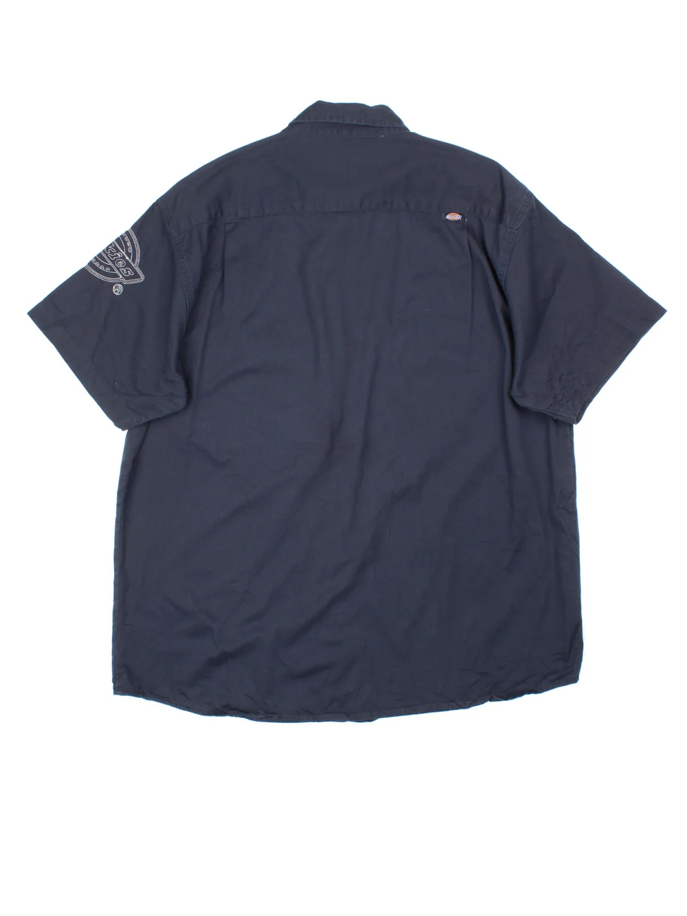 Dickies Work Shirt in a blue colourway, button up and has double chest pockets with the logo embroidered on the front and left sleeve.
