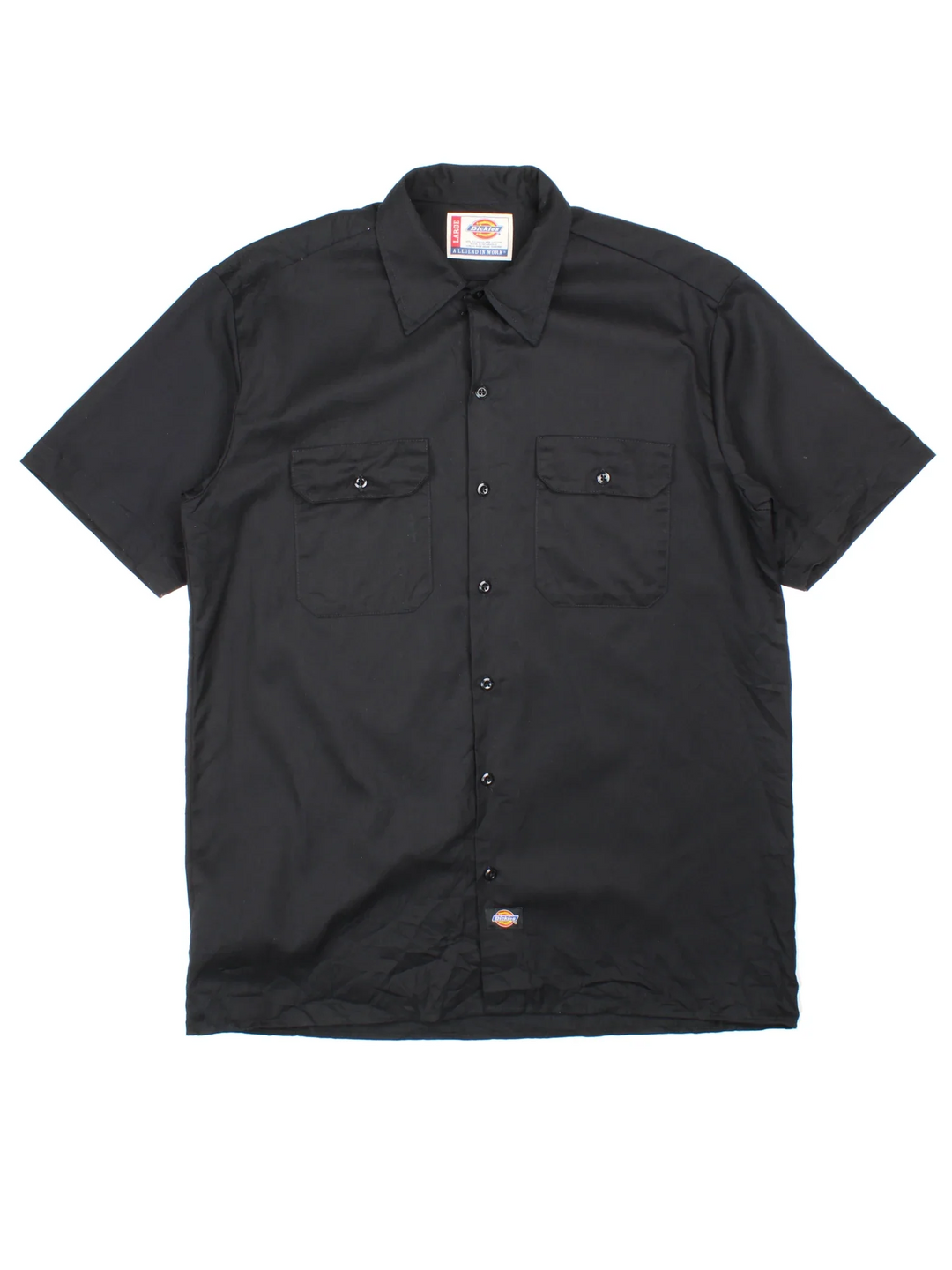 Dickies Work Shirt in a black colourway, button up with double chest pockets and the logo embroidered by the hem.
