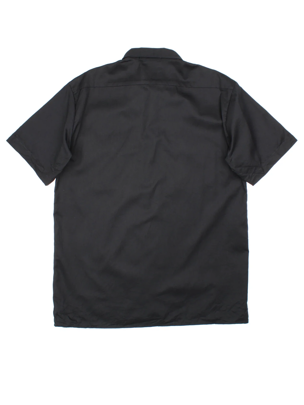 Dickies Work Shirt in a black colourway, button up with double chest pockets and the logo embroidered by the hem.