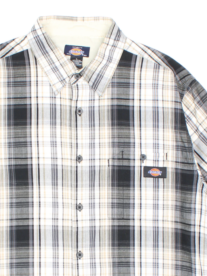 Dickies Shirt in a grey, white and black plaid pattern colourway, button up and has a chest pocket with the logo embroidered on the front.