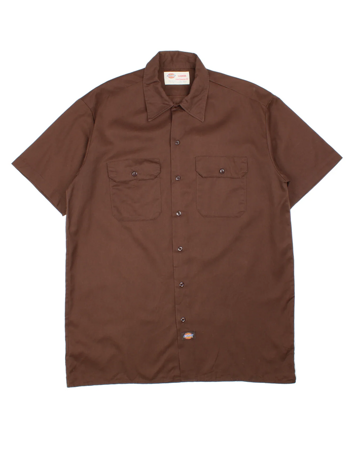 Dickies Work Shirt in a brown colourway, button up with double chest pockets and the logo embroidered by the hem.