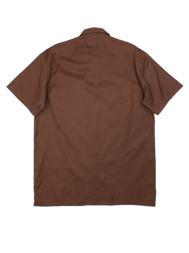 Dickies Work Shirt in a brown colourway, button up with double chest pockets and the logo embroidered by the hem.