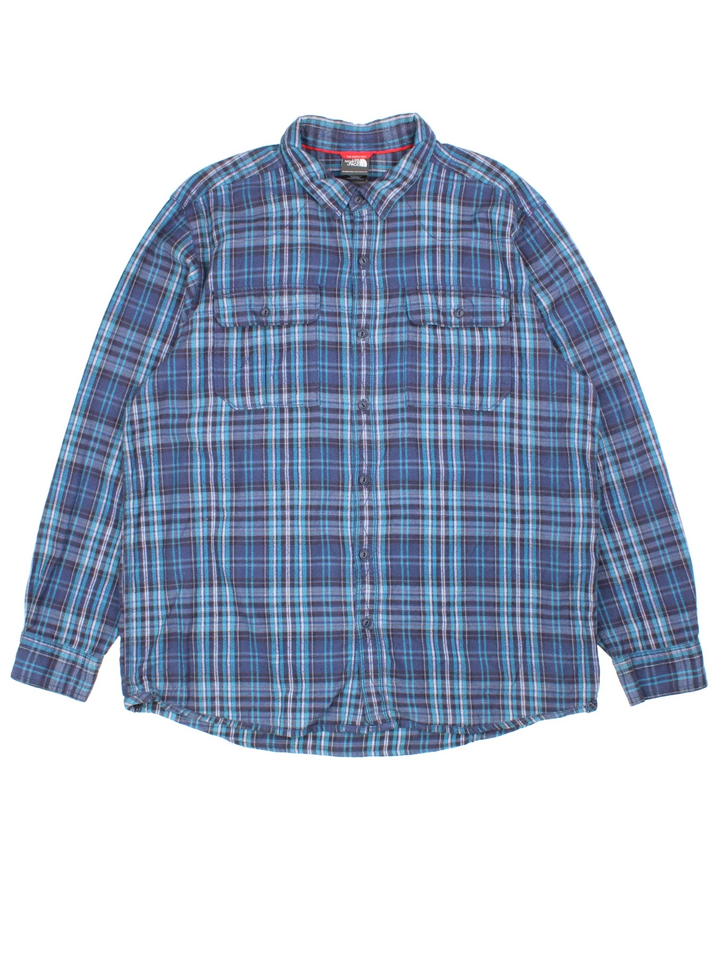 The North Face Flannel Shirt in a blue colourway, button up with two front pockets and all over plaid check pattern.
