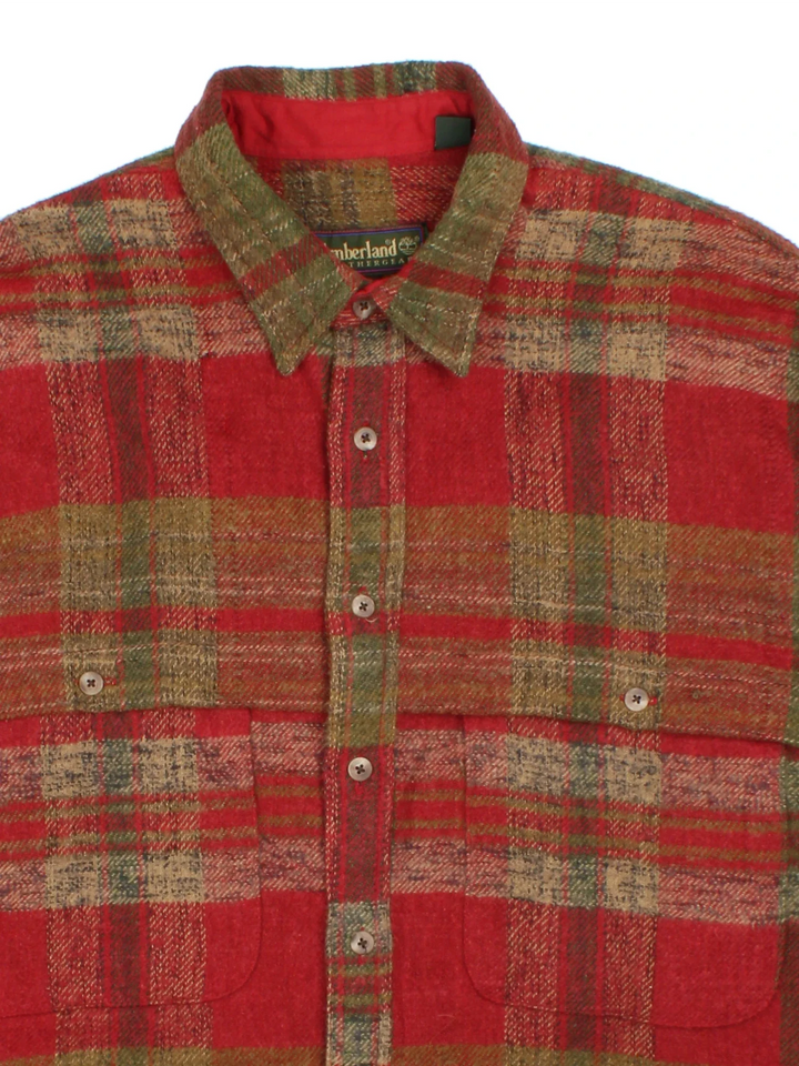 Timberland Flannel Shirt in a red/green colourway. All over checked pattern, button up with x2 pockets on the front.