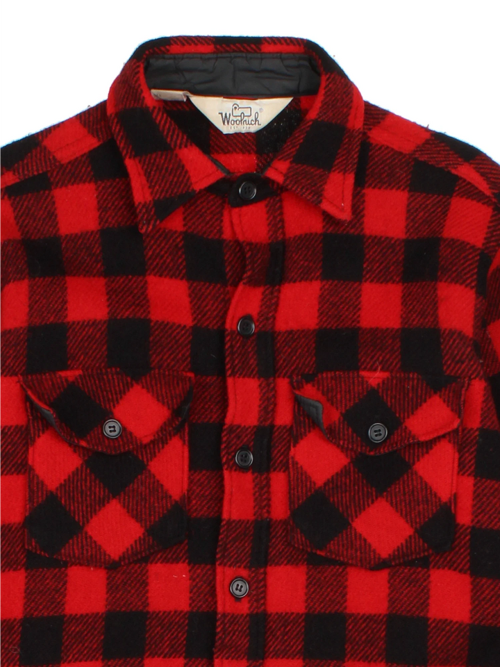 Woolrich Flannel Shirt in a red/black colourway. All over checked pattern, button up with x2 front pockets.