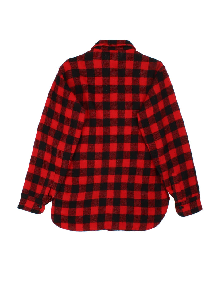 Woolrich Flannel Shirt in a red/black colourway. All over checked pattern, button up with x2 front pockets.