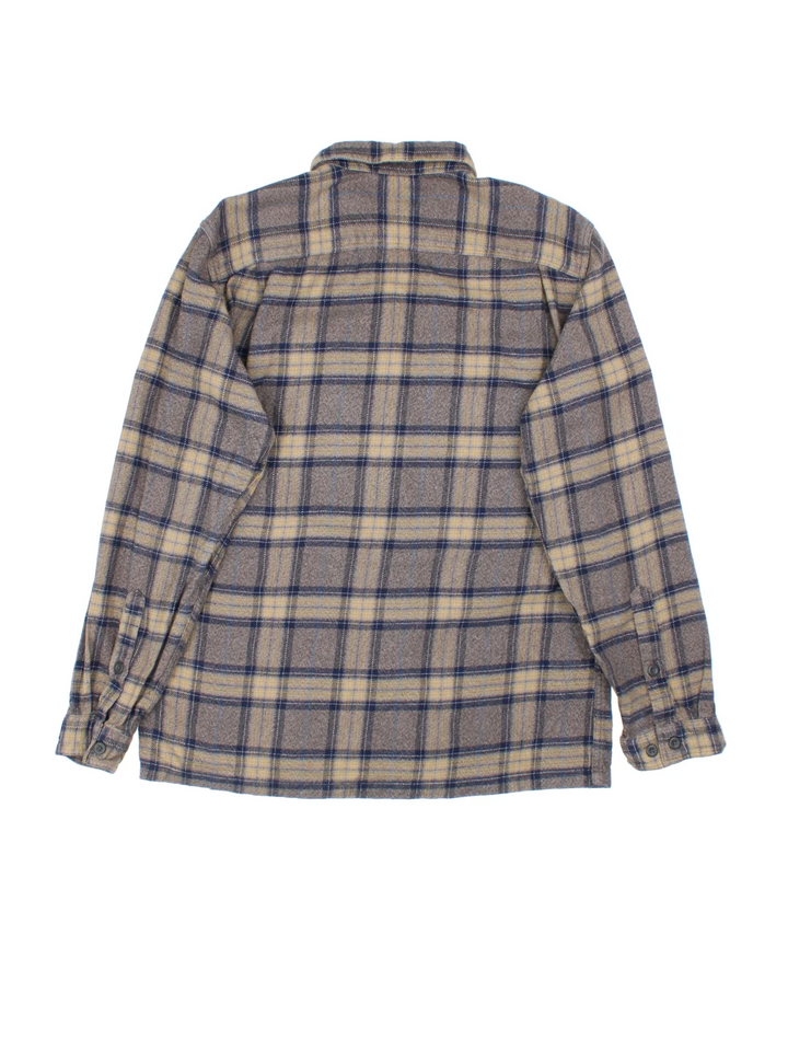 Patagonia Flannel Shirt in a brown colourway. All over checked pattern, button up with x2 front pockets and side tab branding.