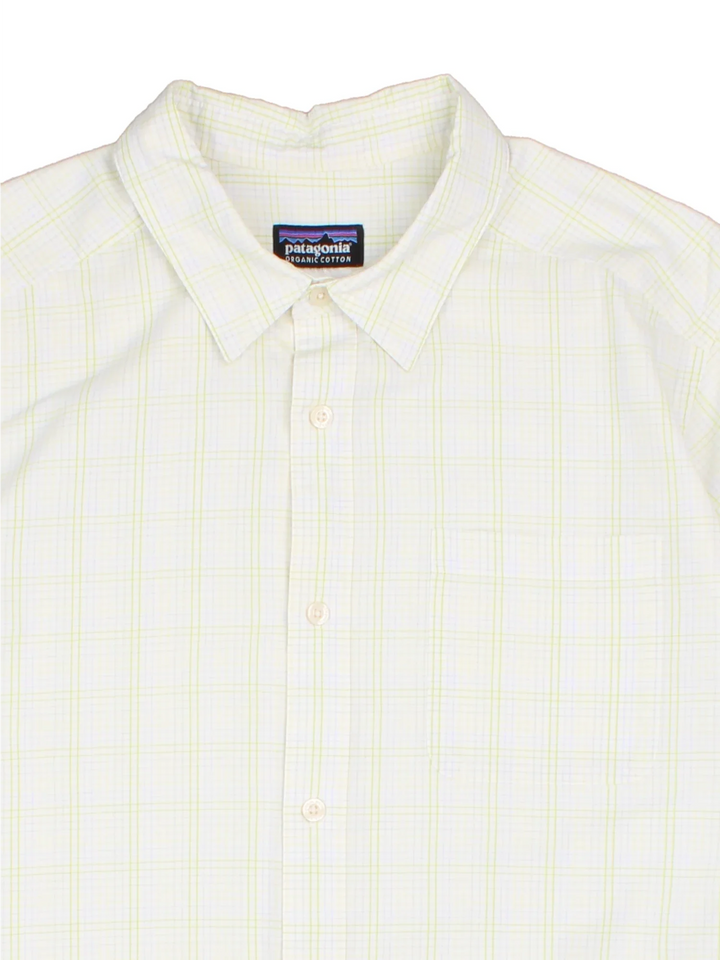 Patagonia Shirt in a white colourway. Button up with front pocket with side tab branding.