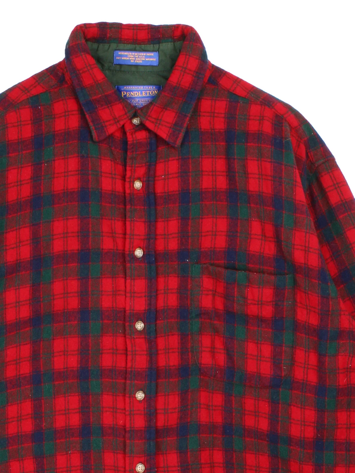 Pendleton Flannel Shirt in a red and black colourway with all over plaid pattern. button up with classic pocket on the front.