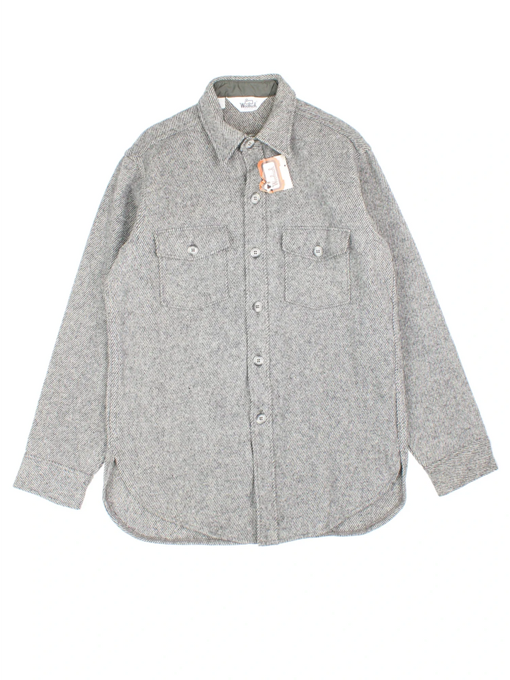 Woolrich Shirt in a grey colourway. Full button up with two pockets on the front.