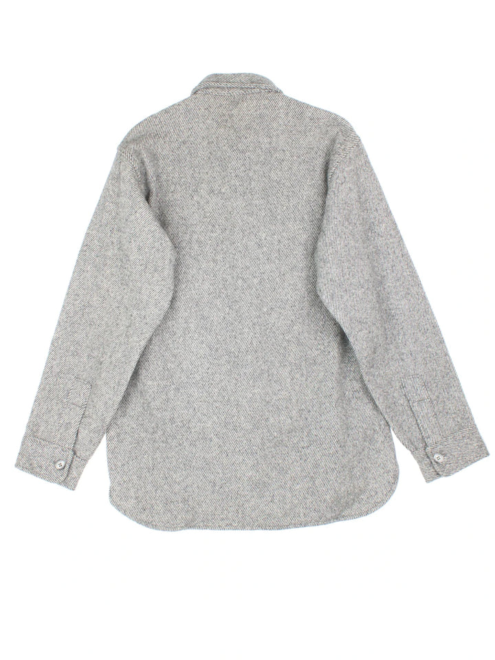 Woolrich Shirt in a grey colourway. Full button up with two pockets on the front.