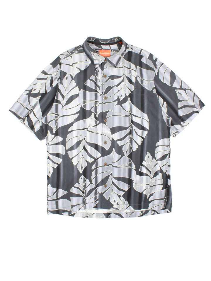 Tommy Bahama Hawaiian Shirt in a grey colourway, button up, front pocket and all over classic hawaiian floral print. 