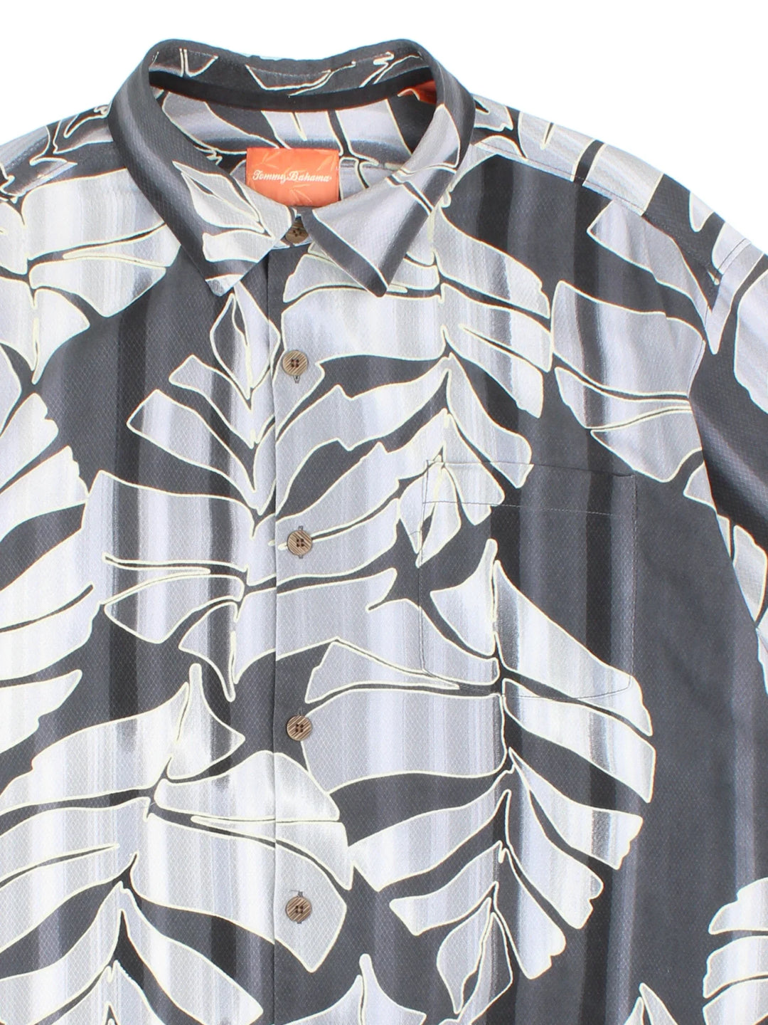 Tommy Bahama Hawaiian Shirt in a grey colourway, button up, front pocket and all over classic hawaiian floral print. 