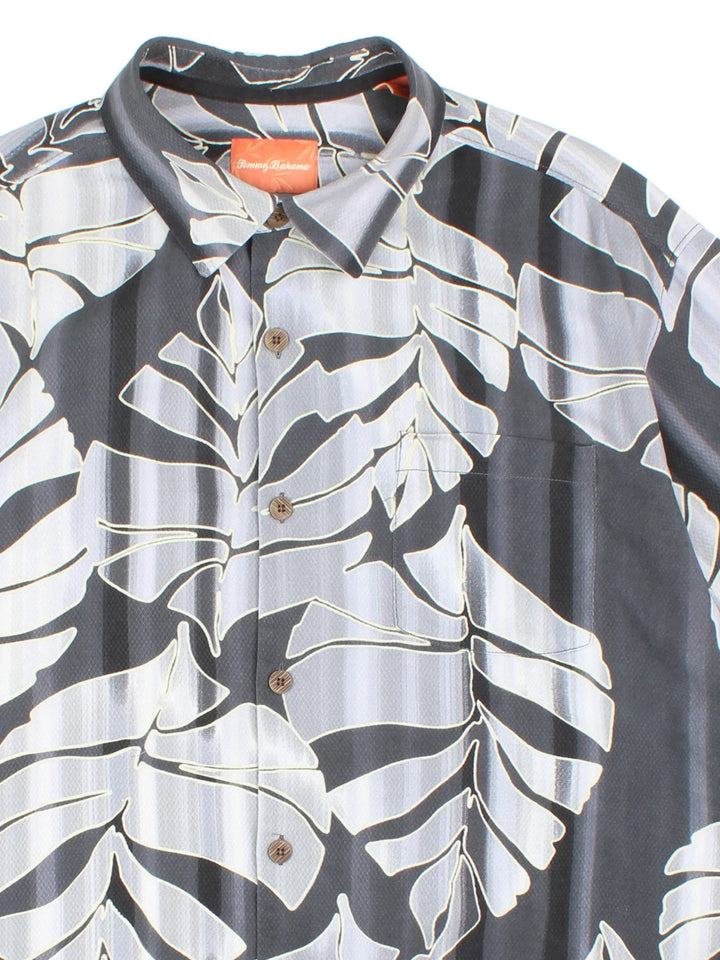 Tommy Bahama Hawaiian Shirt in a grey colourway, button up, front pocket and all over classic hawaiian floral print. 