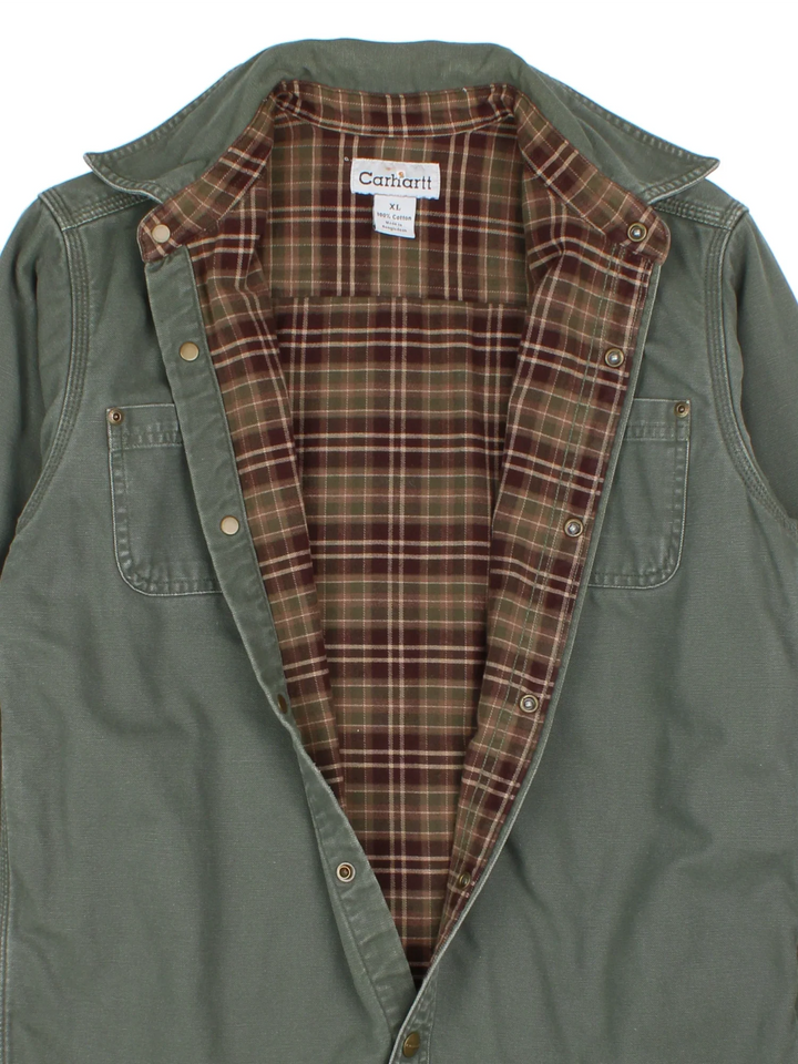 Carhartt Shirt in a green colourway, button up and has double chest pockets.
