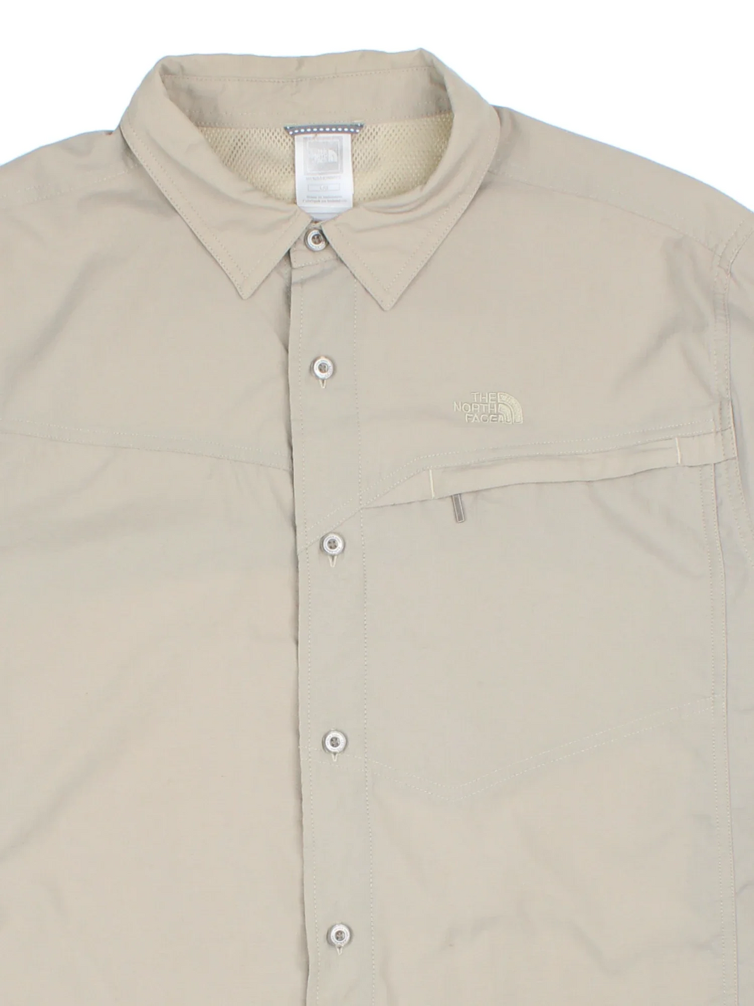 The North Face Ripstop Shirt in a tan colourway, button up and has a chest pocket with the logo embroidered on the front.