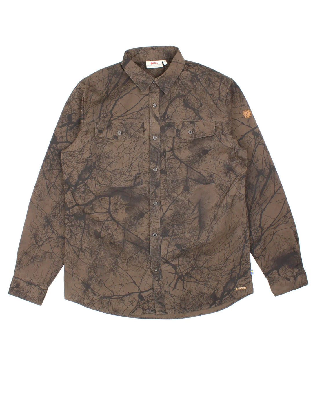Fjallraven G-1000 Varmland Shirt in a brown colourway with all over tree style pattern, button up with double chest pocket and the logo embroidered on the left sleeve.